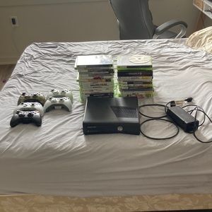 COPY - XBox 360S console  with 30 games 4 controllers. Everything works